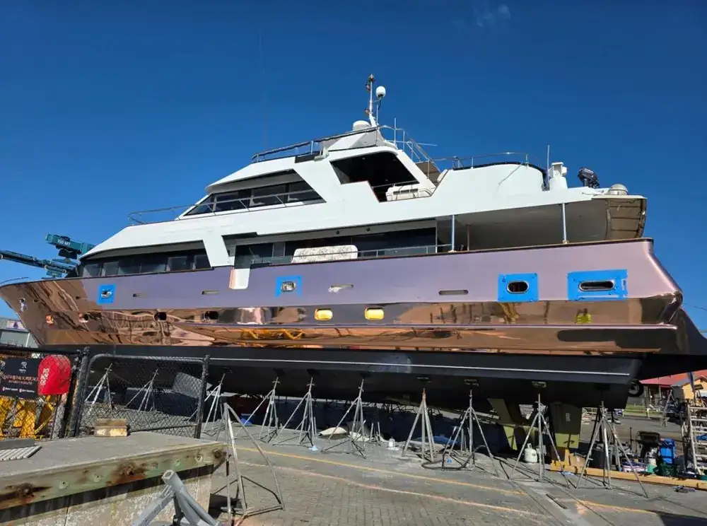 Boat hull being repainted in dry dock