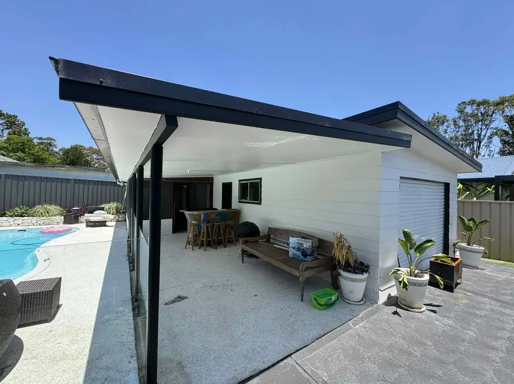 Covered outdoor entertaining area and pool after repainting