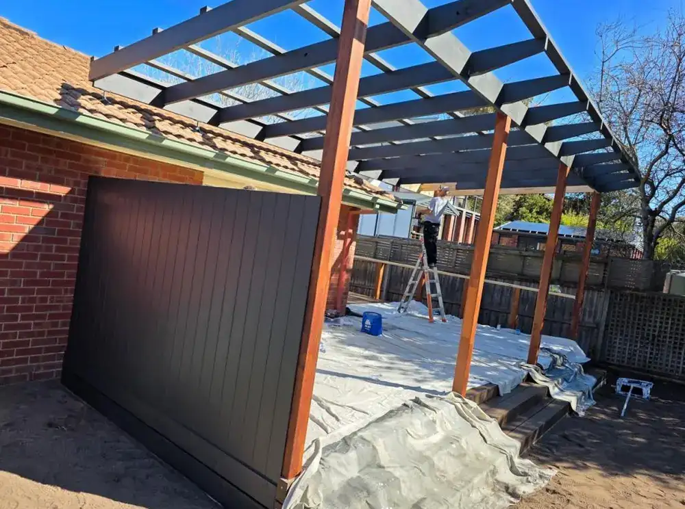 Pergola and Colorbond garage door being prepared for painting